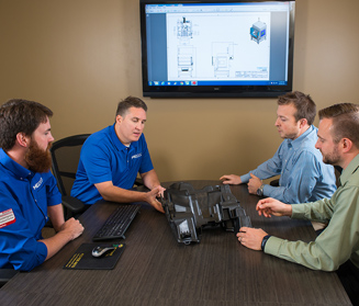 MECCO team evaluating a part for marking MECCO team evaluating a part for marking